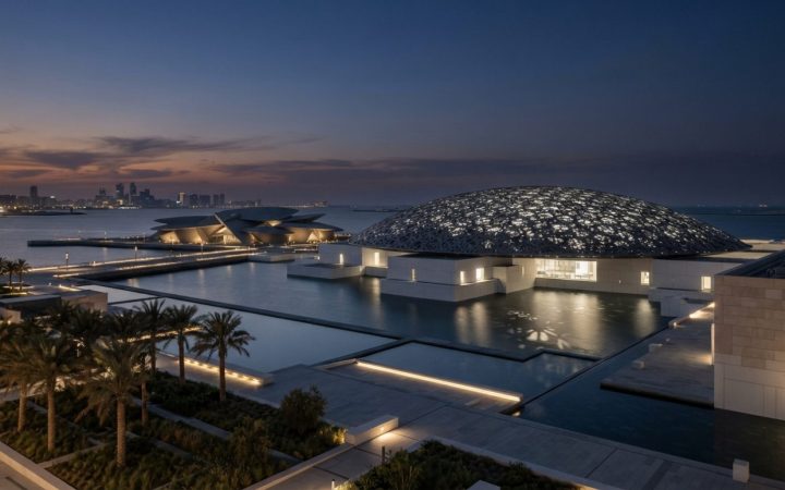 Illustration: Editorial news photograph of the modern cultural district on Saadiyat Island in Abu Dhabi at dusk, showcasing contemporary architectural
