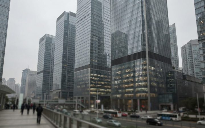 Illustration: Editorial photograph showing modern commercial bank skyscrapers in an international financial centre under an overcast sky, with reflect
