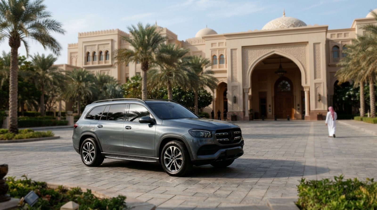 Illustration: A modern premium luxury SUV parked on a paved driveway in front of a grand Arabian palace resort with palm trees under bright daytime su