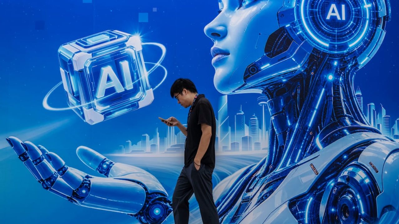 Man walking past a large futuristic artificial intelligence robot backdrop at a technology exhibition