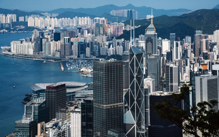 High-angle view of Hong Kong financial district skyscrapers and Victoria Harbour