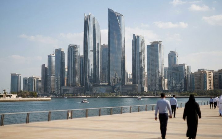 Illustration: A modern skyline of Abu Dhabi or Dubai financial district with towering glass skyscrapers and high-rise commercial architecture under br
