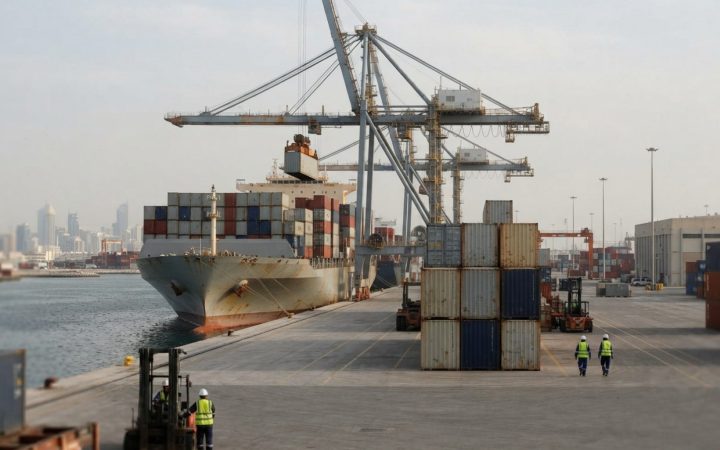 Illustration: Commercial cargo ships and stacks of shipping containers at a modern Middle Eastern deepwater port terminal during daytime, with cranes