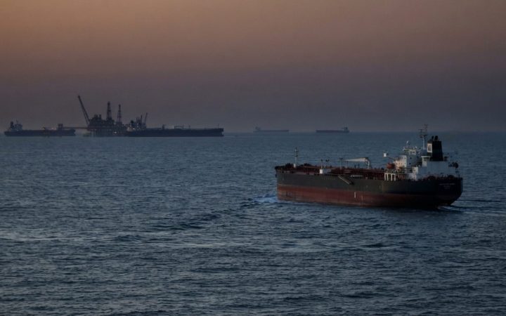 Illustration: An oil tanker navigating international waters at dusk, viewed from a distance, with calm waves and an industrial maritime horizon under