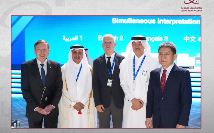 International business and government delegates standing together at a conference
